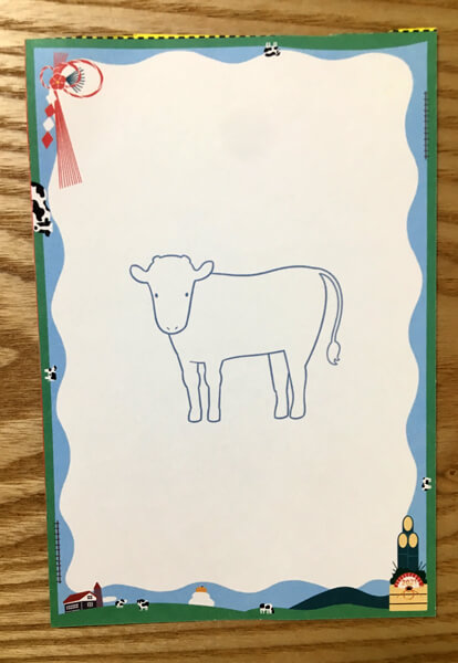 切手を貼って出すこともできる牛の絵の年賀状